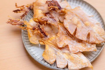 Dried squid snack in the plate