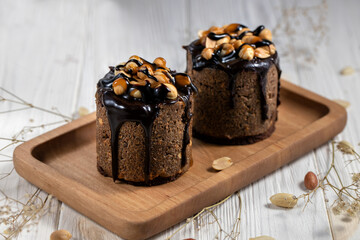 Two tasty mini cupcakes,homemade muffin with peanut and chocolate.Snickers