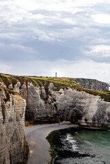 View of Etretat Aval cliff and rocks landmark with lighthouse. Normandy, France. Beautifull landscape   Natural amazing cliffs. La Manche