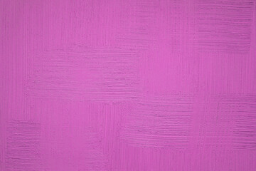 Saturated purple plaster background. Wall of pink colorful stucco