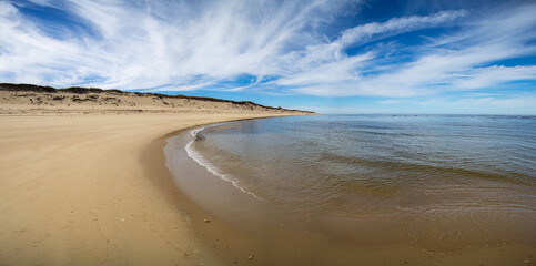 Cove Landscape Of A Sandy Beach And Sand Dunes Against A Beautiful Cloudy Blue Sky At Cape Cod, Massachusetts, USA