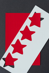 stencil with stars on red and gray paper