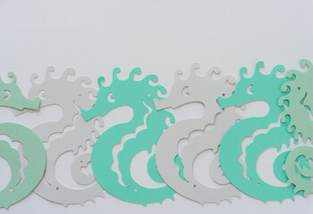 set of paper seahorses with blank space
