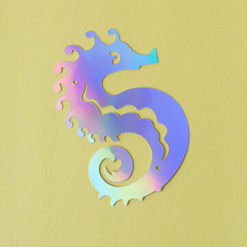 foil card stock paper seahorse (with iridescent rainbow effect) on yellow paper