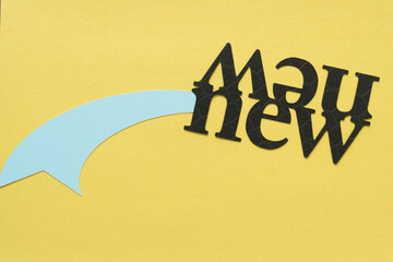 paper tail/ribbon and the word 