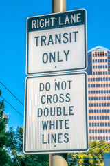 Obraz premium Right lane transit only and do not cross double white lines road signs in downtown Tucson, Arizona