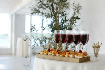 beautifully served glasses of champagne and wine at sunset in the restaurant