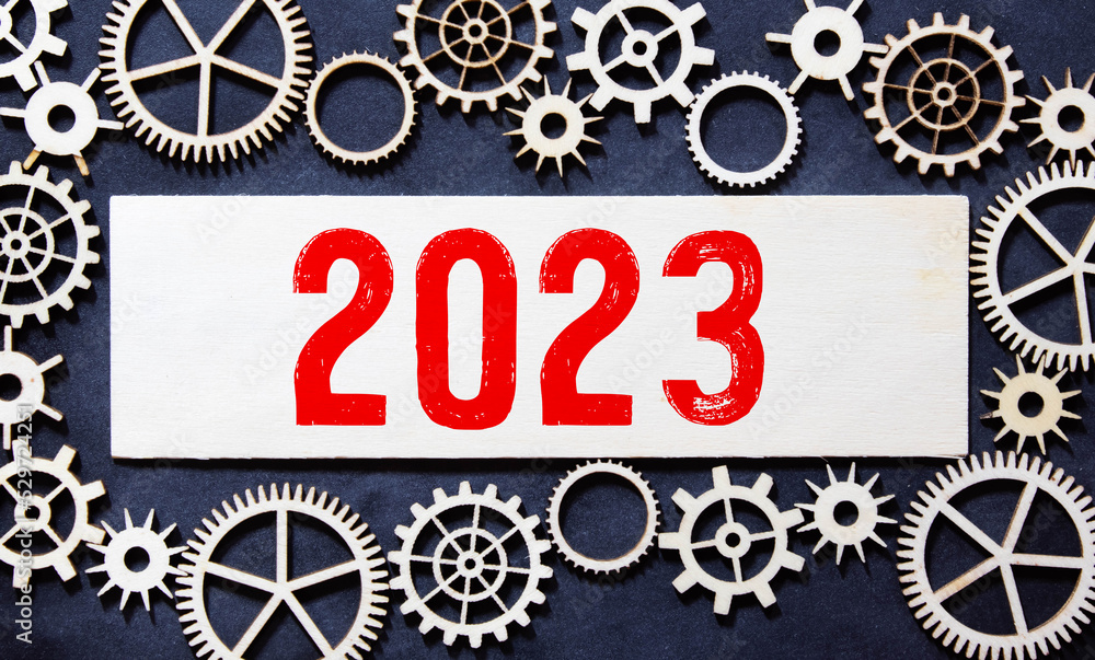 Poster happy new year 2023 on wood cube block and blur abstract bokeh light background with cop space for t