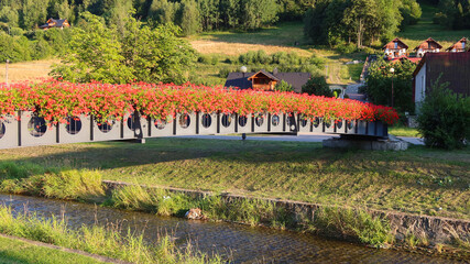 Footbridge over the Zylica river in Szczyrk, Poland. Panoramic view
