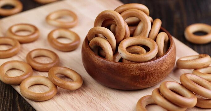 a solid bagel is moving on the table, delicious traditional Russian food round bagels for tea