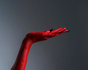 Scary female monster hands halloween character red color isolated on white background. © Phushutter