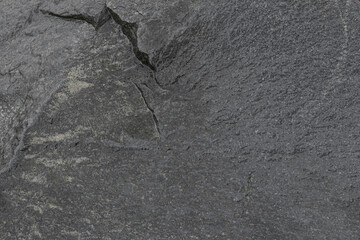 Textured of old stone surface as background, closeup