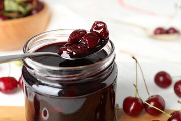 Jar of delicious pickled cherries, closeup view