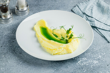 mashed potatoes on bowl on grey table