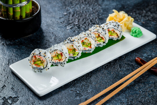 California roll with crab on dark stone table