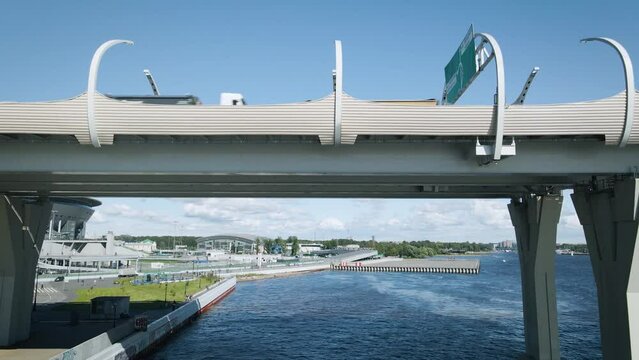 Russia. Saint Petersburg. Aerial view inder the Cable-stayed Bridge of the Arena next to ZSD highway and Tallest skyscraper Lahta center in Europe on the banks of the Neva 06.04.2022
