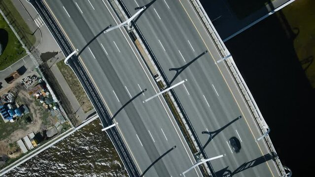 Saint Petersburg, Russia - 06.08.2022: Aerial view of the ZSD Highway and the Cable-stayed Bridge on the banks of the Neva, camera down