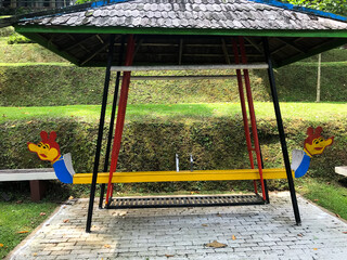 An Empty Swing with canopy in the park
