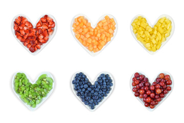Heart Health Concept - Fresh Fruit atop Heart Shaped Plates - Isolated