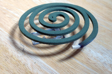 Fototapeta na wymiar Burning mosquito coil is an anti-mosquito repellent, selective focus 
