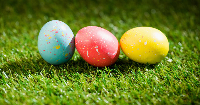 Image of colourful easter eggs on grass