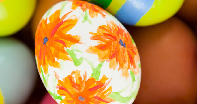 Image of multiple colourful easter eggs lying