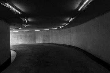 Road tunnel black and white, night illuminated, Urban tunnel without traffic, illuminated city...
