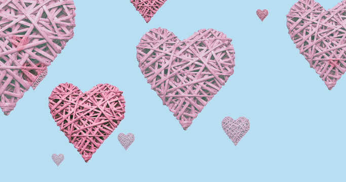 Image of flying pink hearts on blue background