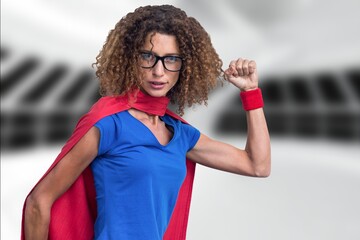 Composite image of african american woman in superhero costume against empty office in background © vectorfusionart