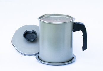 Gray oil filter pot with black handle with top cover and base Use to filter the oil through a sieve...