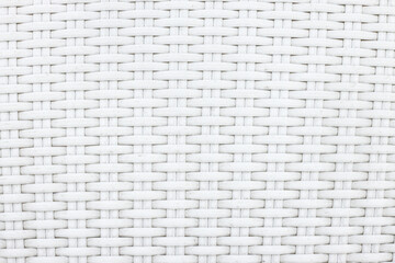 White artificial rattan pattern. Background of basket structure close-up. Furniture backdrop.