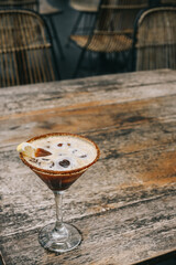 Coffee mocktail with sunkist garnish on a wooden table