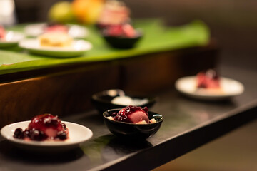 cakes, ice cream with blueberry sauce in the buffet hotel bar