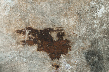 old plaster background where rust settles on the cement floor