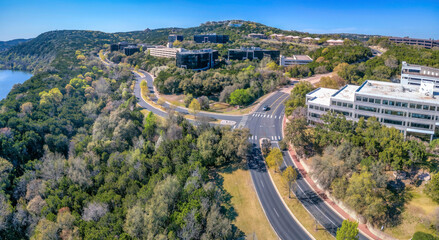 Austin, Texas- Aerial view of business buildings in the middle of forest near the river