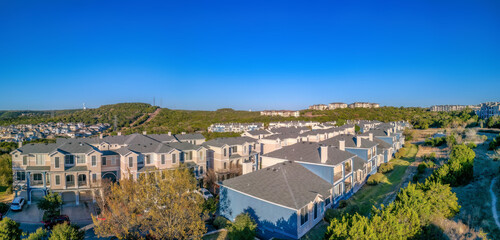 Austin, Texas- Neighborhood with three-storey adjacent buildings with attached garage