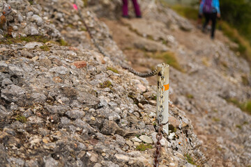 Some chains placed on a rock in a mountain hiking trail used as safety measure for the mountaineers...
