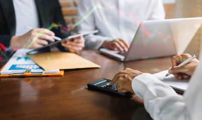 Close up Businessman and partner using calculator and laptop for calculation finance, tax, accounting, statistics and analytic research concept.