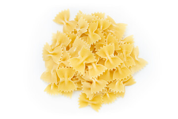 Raw farfalle pasta on white background a lot of dry pieces.