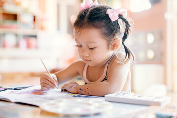 Asian girls are practicing drawing and painting intentionally for fun