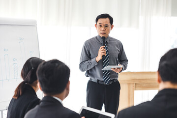 The supervisor is presenting business plans to employees in the company