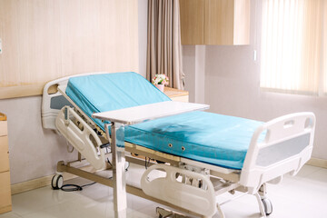 Empty patient emergency bed for wound dressing with curtains in hospital