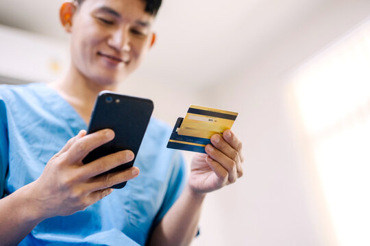 Patient is doing financial transactions by smartphone and credit card mockup. ,Convenience concept of payment with technology