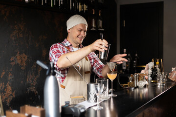 Barman at work, preparing cocktails. concept about service and beverages.