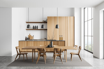 Light kitchen interior with table and chairs, cooking and eating area, window