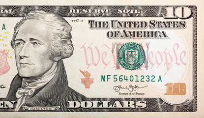 Alexander Hamilton face on US ten or 10 dollars bill macro, united states money closeup. Ten dollar...