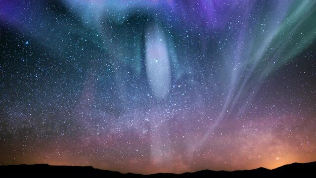 Aurora Green Purple Red and Milky Way Galaxy Over Hills Tilt Up