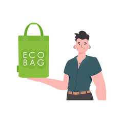 A man holds an ECO BAG in his hands. ECO friendly concept.   Trend style. .
