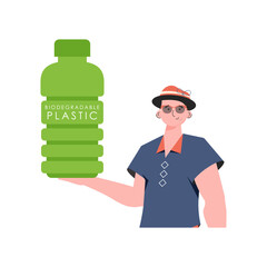 A man holds a bottle made of biodegradable plastic in his hands. Concept of green world and ecology.   Fashion trend illustration in
