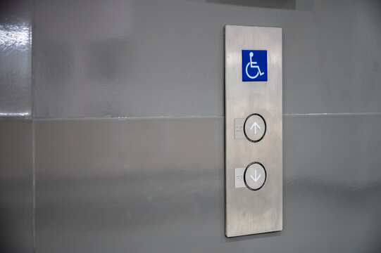 ฺButton of elevator for blind or disability people. (disabled lift)